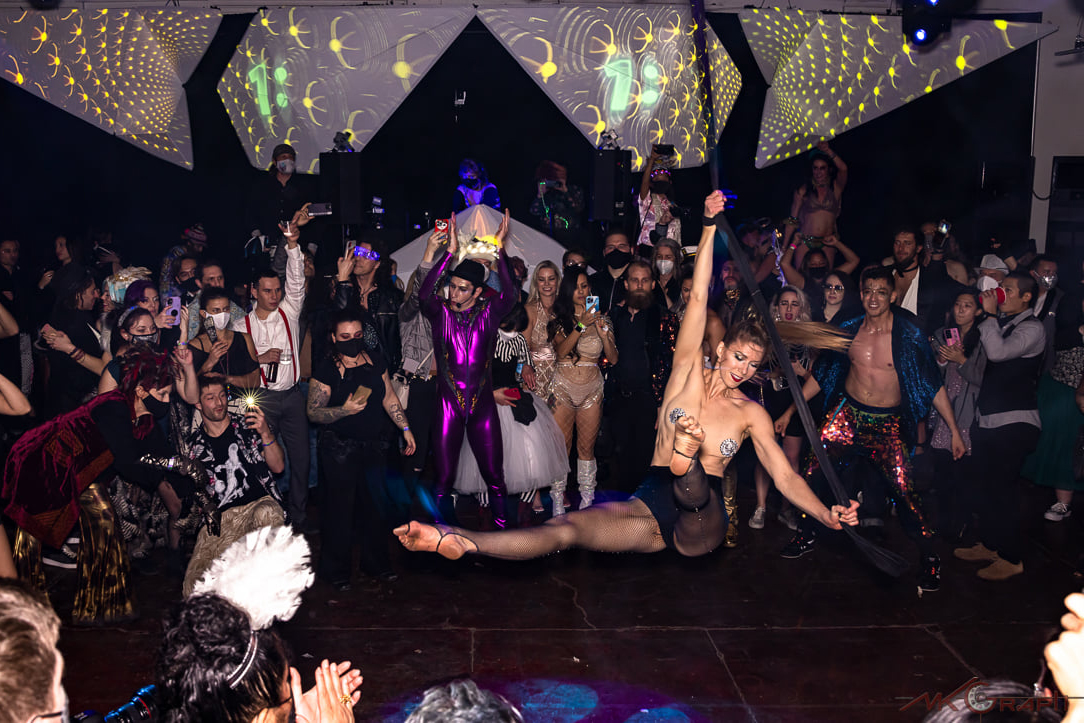 Image of Vau de Vire Society aerialist, Cassandra, performing on aerial straps at New Bohemia NYE